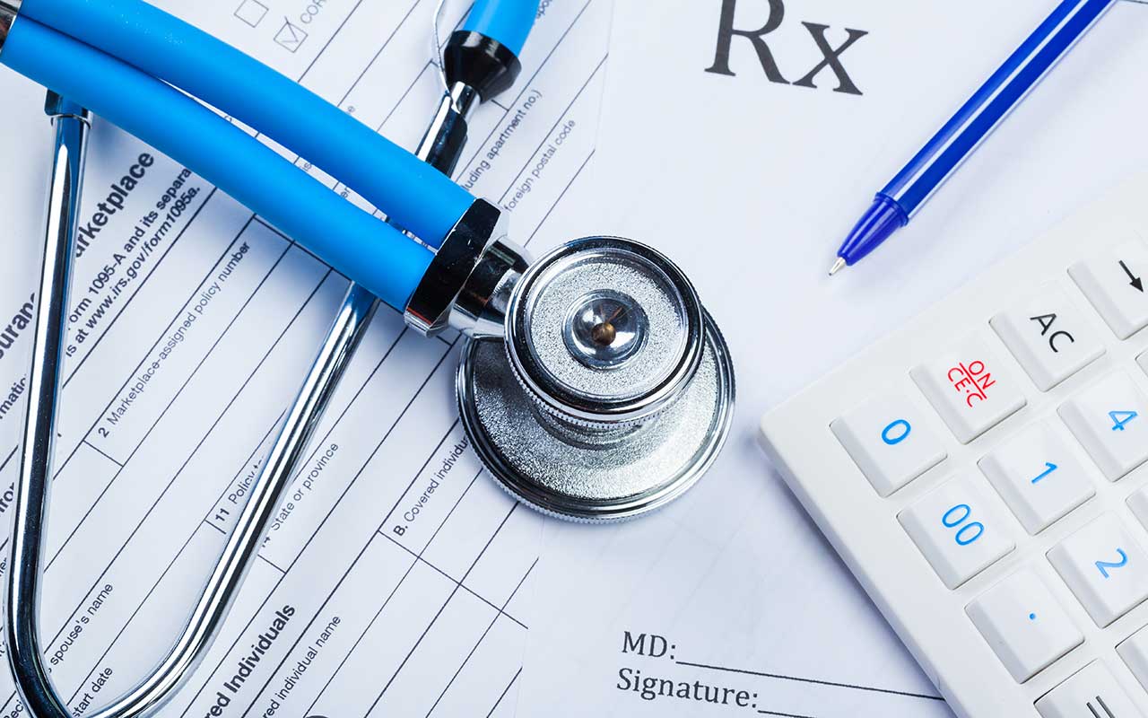 health-care-costs-stethoscope-and-calculator-2022-06-10-16-57-41-utc